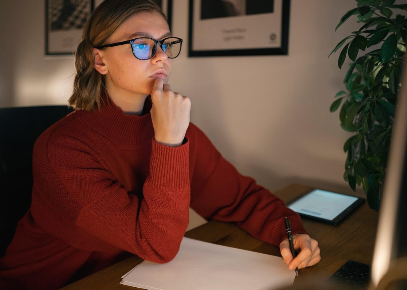 Students reviewing financial reports and budget spreadsheets during practical workshop session